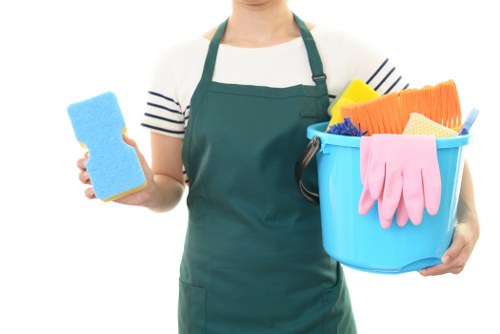 Cleaner preparing a workspace with safety awareness and protective equipment