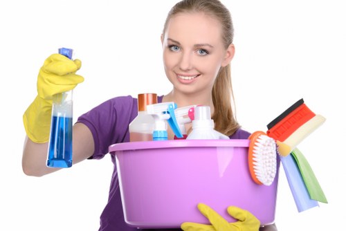 Worker practicing safe cleaning procedures and hygiene standards