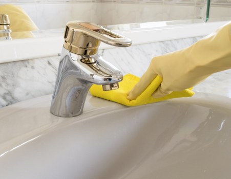 Cleaning staff following health and safety practices during a professional service